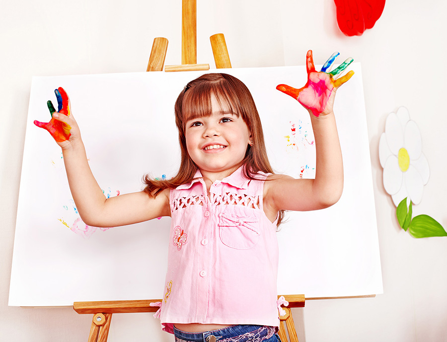 Child paint picture in preschool.